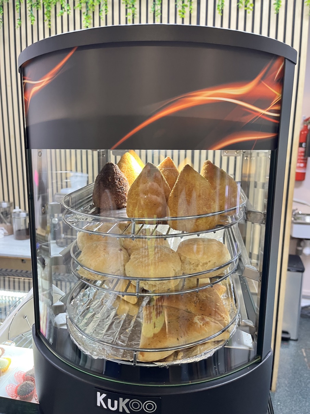Warm coxinha and savoury snacks in the hot display at Lakcakes